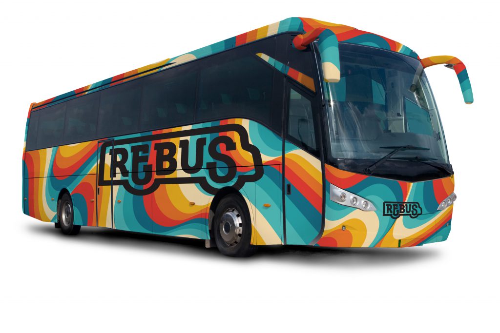 a coach bus with a rainbow print covering it and the REBUS logo on the side.