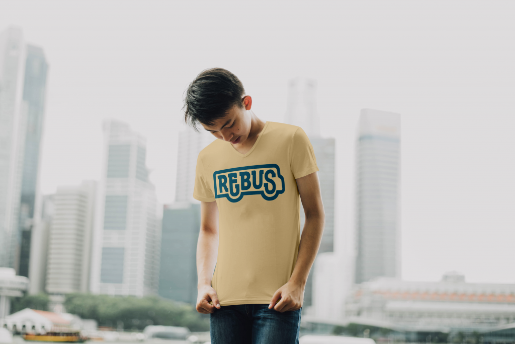 A male model shows off the REBUS plain t-shirt.